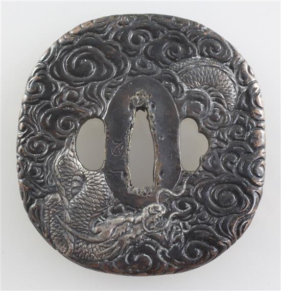 A late 19th/early 20th century Japanese silvered bronze tsuba, 3in.